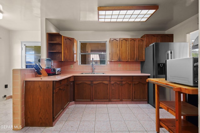8108 Edgemere Blvd, El Paso, TX 79925 - kitchen with a sink, light countertops, decorative backsplash, and open shelves