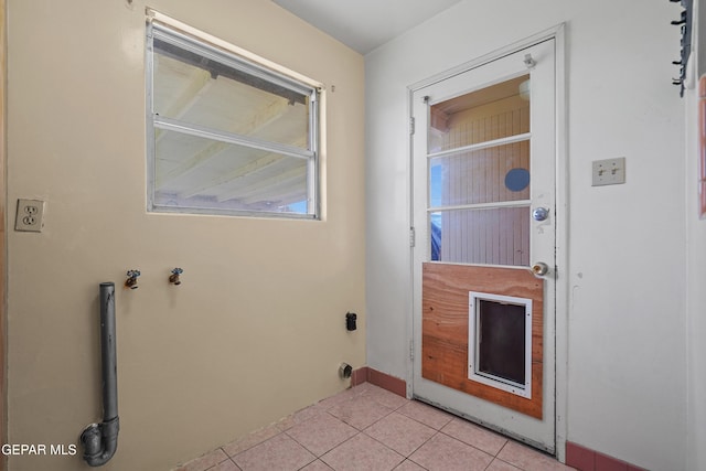 8108 Edgemere Blvd, El Paso, TX 79925 - laundry room with light tile patterned flooring and baseboards