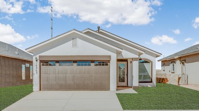 14294 Kayla Mia Dr, El Paso, TX 79938 - single story home featuring concrete driveway, a garage, a front lawn, and stucco siding