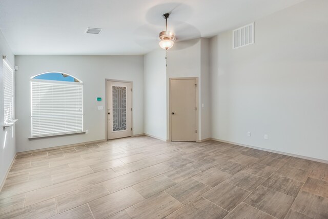 14294 Kayla Mia Dr, El Paso, TX 79938 - unfurnished room featuring ceiling fan, vaulted ceiling, wood tiled floors, and baseboards