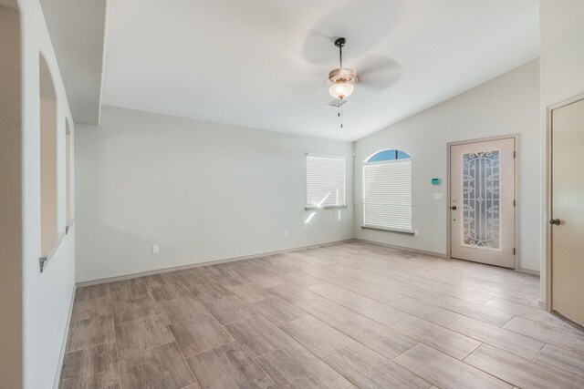 14294 Kayla Mia Dr, El Paso, TX 79938 - empty room with a ceiling fan, wood tiled floors, lofted ceiling, and baseboards