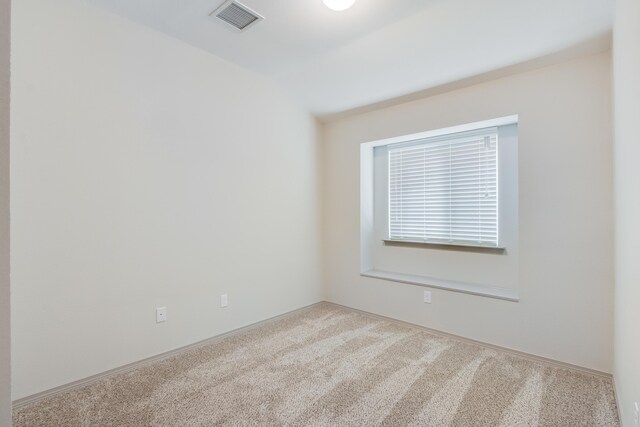 14294 Kayla Mia Dr, El Paso, TX 79938 - spare room featuring carpet floors, lofted ceiling, and baseboards