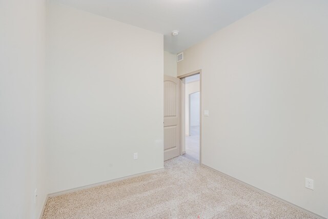 14294 Kayla Mia Dr, El Paso, TX 79938 - empty room featuring baseboards, a smoke detector, and light carpet