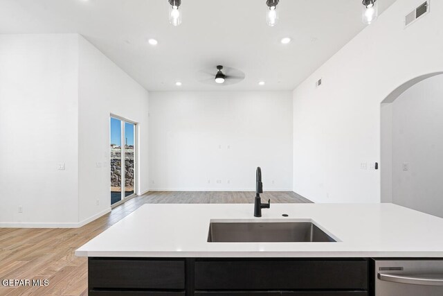 13797 Summer Wave Ave, El Paso, TX 79928 - kitchen featuring a sink, dishwasher, light countertops, recessed lighting, and light wood-type flooring