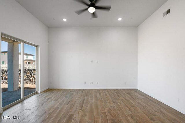 13797 Summer Wave Ave, El Paso, TX 79928 - spare room with wood finished floors, a ceiling fan, recessed lighting, and baseboards