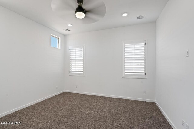 13797 Summer Wave Ave, El Paso, TX 79928 - spare room with ceiling fan, dark colored carpet, and baseboards