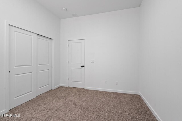 13797 Summer Wave Ave, El Paso, TX 79928 - unfurnished bedroom featuring carpet floors, baseboards, and a closet