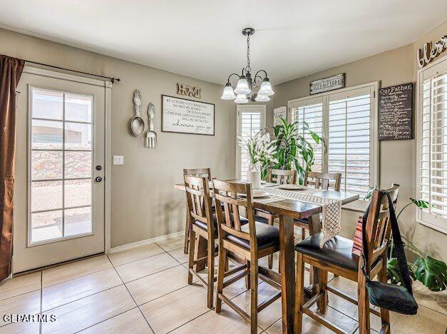 13649 Mill Hill Ct, El Paso, TX 79928 - dining space with a chandelier, light tile patterned floors, and baseboards