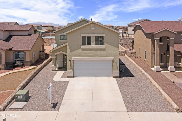 7237 Dust Storm Ln, El Paso, TX 79934 - view of front of home featuring a residential view, driveway, an attached garage, and stucco siding