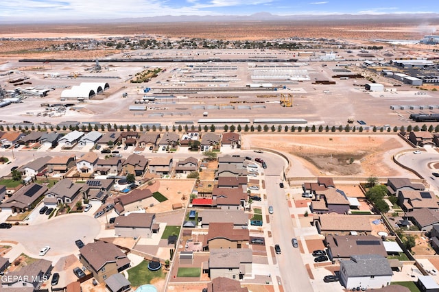 7237 Dust Storm Ln, El Paso, TX 79934 - aerial view of property and surrounding area featuring a mountainous background and nearby suburban area
