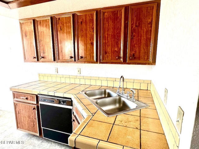 2520 San Jose Ave Unit 2D, El Paso, TX 79930 - kitchen with dishwasher, a sink, and tile counters
