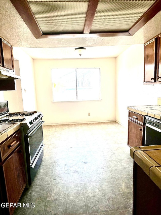 2520 San Jose Ave Unit 2D, El Paso, TX 79930 - kitchen with range with gas stovetop, tile countertops, dishwashing machine, under cabinet range hood, and dark brown cabinets