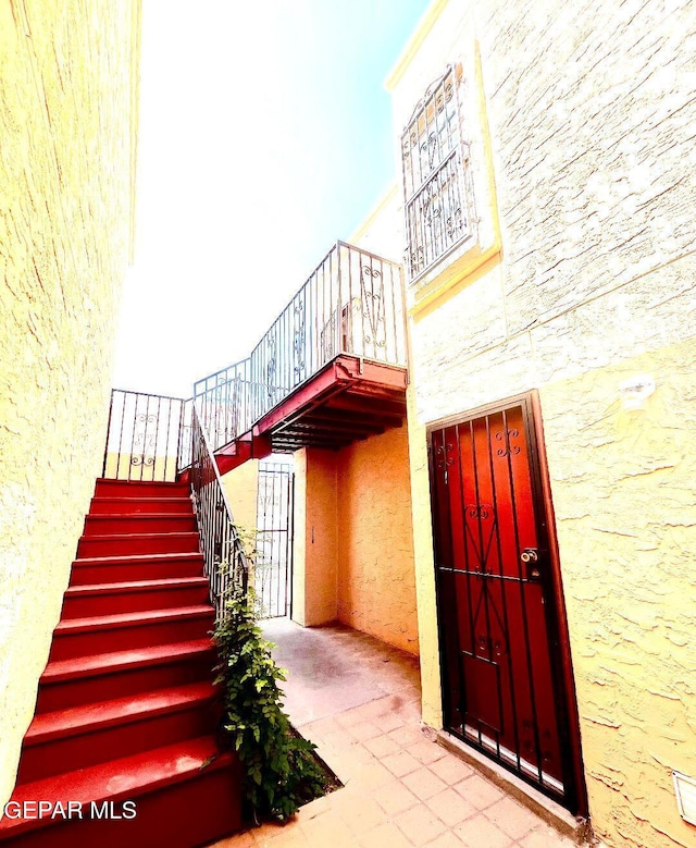 2520 San Jose Ave Unit 2D, El Paso, TX 79930 - stairs with a towering ceiling