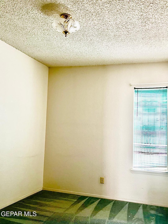2520 San Jose Ave Unit 2D, El Paso, TX 79930 - spare room with carpet and a textured ceiling