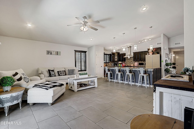 14701 Tim Hardaway, El Paso, TX 79938 - living room with ceiling fan, light tile patterned floors, lofted ceiling, and recessed lighting