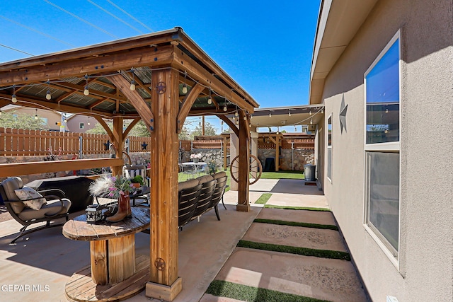 14701 Tim Hardaway, El Paso, TX 79938 - fenced backyard with a patio, a gazebo, and outdoor dining area