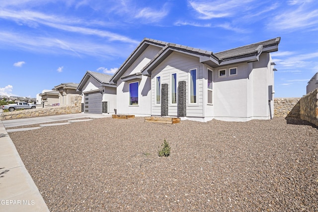 12264 Clifton Hill Rd, El Paso, TX 79928 - single story home featuring concrete driveway, a tiled roof, and a garage