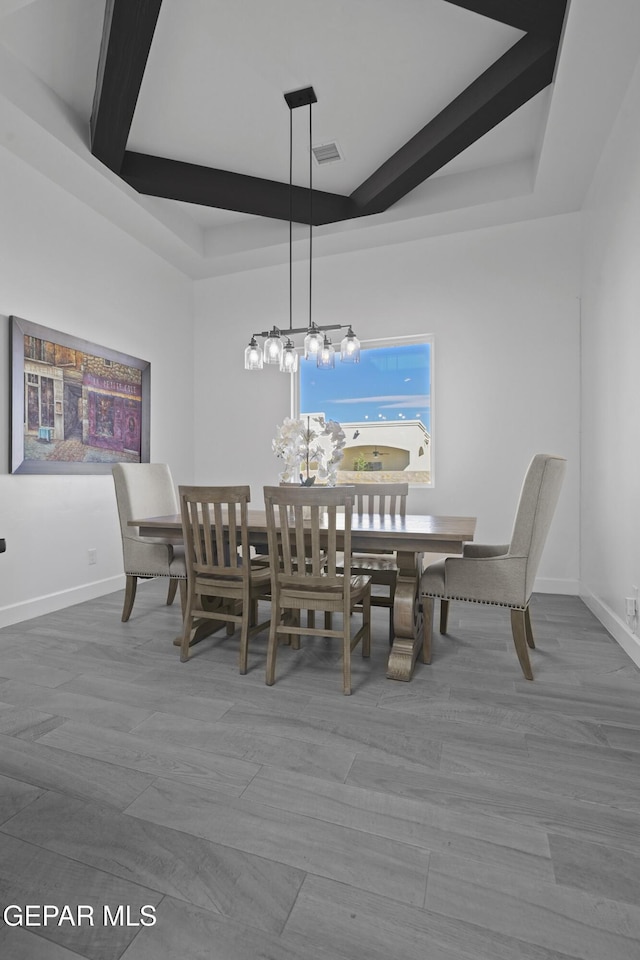 12264 Clifton Hill Rd, El Paso, TX 79928 - dining space featuring beam ceiling, wood finished floors, and a chandelier