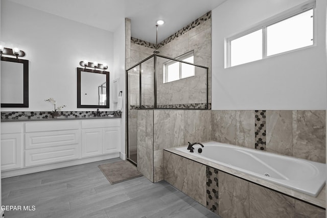 12264 Clifton Hill Rd, El Paso, TX 79928 - bathroom with a shower stall, a garden tub, double vanity, and wainscoting