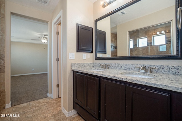 117 Camino Cresta Pl, Horizon City, TX 79928 - full bath featuring double vanity, ceiling fan, and baseboards