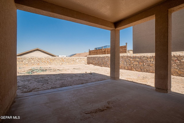 117 Camino Cresta Pl, Horizon City, TX 79928 - fenced backyard with a patio area