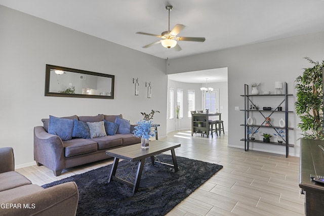 13142 Emerald Isle St, El Paso, TX 79928 - living area featuring a chandelier, ceiling fan, and wood tiled floors