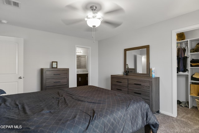 13142 Emerald Isle St, El Paso, TX 79928 - carpeted bedroom with a walk in closet, a closet, ensuite bath, and a ceiling fan