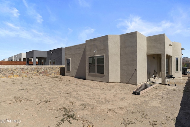 13142 Emerald Isle St, El Paso, TX 79928 - back of property featuring stucco siding