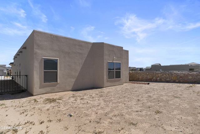 13142 Emerald Isle St, El Paso, TX 79928 - back of property with stucco siding