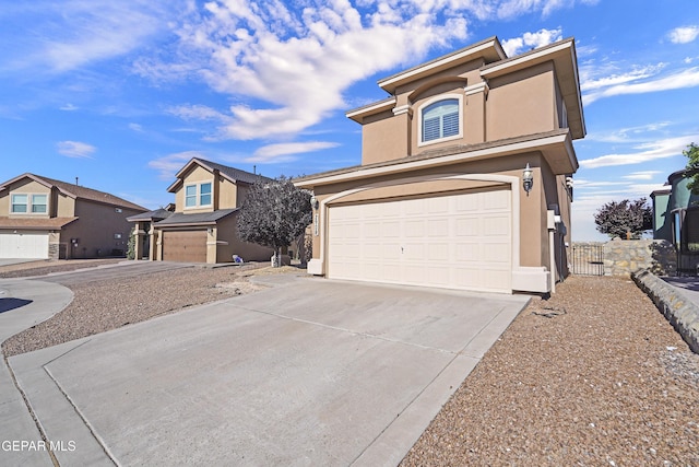 2909 Pino Triste Dr, El Paso, TX 79938 - traditional-style house featuring stucco siding, an attached garage, and concrete driveway