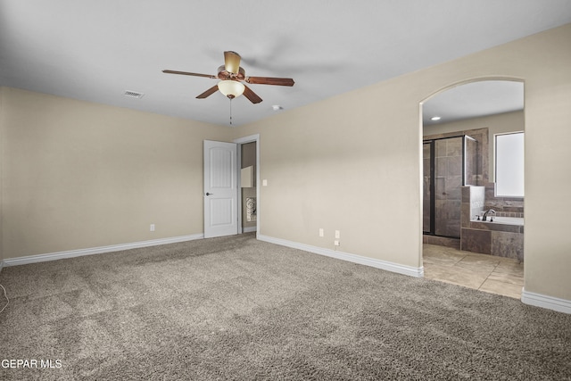 2909 Pino Triste Dr, El Paso, TX 79938 - unfurnished room with ceiling fan, light colored carpet, and arched walkways