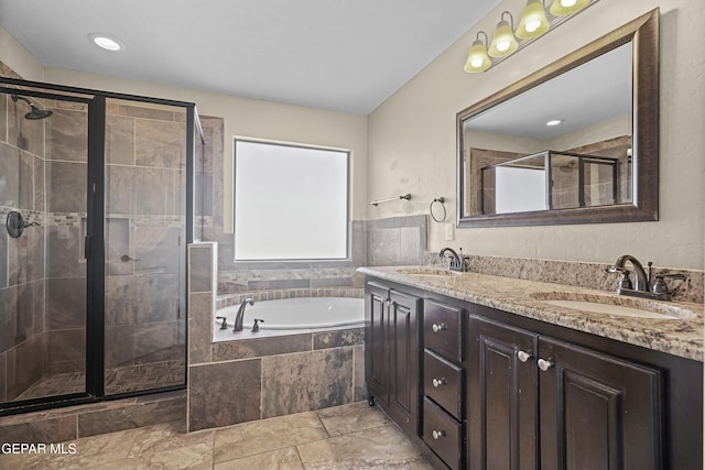 2909 Pino Triste Dr, El Paso, TX 79938 - bathroom featuring a garden tub, double vanity, and a shower stall