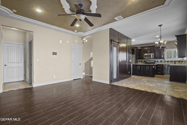 2909 Pino Triste Dr, El Paso, TX 79938 - unfurnished living room with a chandelier, ceiling fan, light wood-style flooring, and a tray ceiling