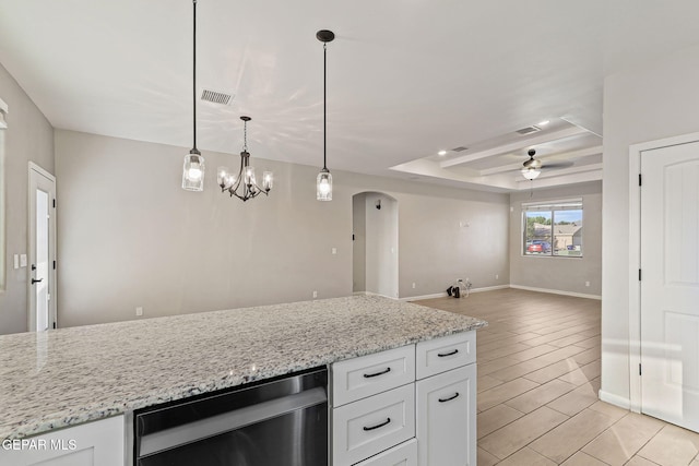 6037 Vicente Gomez Ln, El Paso, TX 79932 - kitchen with arched walkways, a raised ceiling, white cabinetry, and a ceiling fan