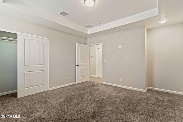 6037 Vicente Gomez Ln, El Paso, TX 79932 - unfurnished bedroom with carpet, a raised ceiling, baseboards, and a closet
