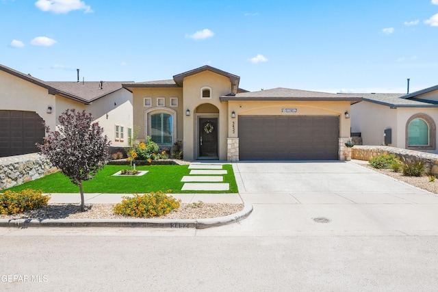 3452 David Palacio Dr, El Paso, TX 79938 - mediterranean / spanish-style house with an attached garage, stucco siding, a front lawn, driveway, and stone siding
