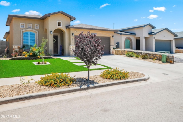 3452 David Palacio Dr, El Paso, TX 79938 - mediterranean / spanish house featuring an attached garage, stucco siding, driveway, and a front lawn