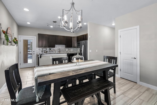 3452 David Palacio Dr, El Paso, TX 79938 - dining space featuring a chandelier and recessed lighting