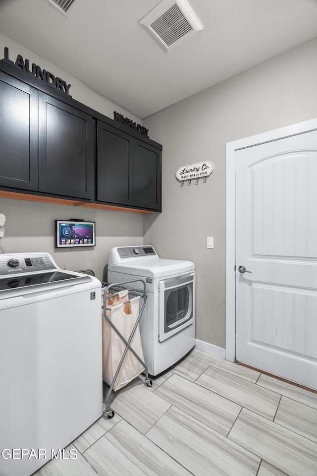 3452 David Palacio Dr, El Paso, TX 79938 - laundry room with washer and clothes dryer and cabinet space
