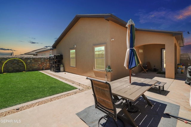 3452 David Palacio Dr, El Paso, TX 79938 - back of property with stucco siding, a patio, and outdoor dining space