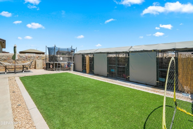 3452 David Palacio Dr, El Paso, TX 79938 - view of yard with a trampoline, a patio, and an outdoor structure