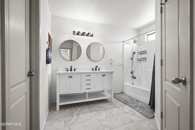 14236 Rattler Point Dr, El Paso, TX 79938 - bathroom featuring shower / bathtub combination, double vanity, marble finish flooring, and baseboards