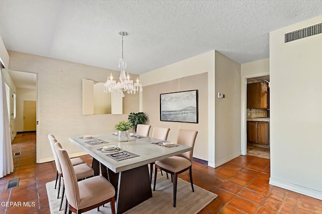 3134 Mesa Verde Ln, El Paso, TX 79904 - dining area with a chandelier, baseboards, and dark tile patterned flooring