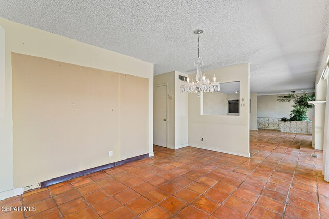 3134 Mesa Verde Ln, El Paso, TX 79904 - unfurnished room with a chandelier, a textured ceiling, tile patterned flooring, and baseboards