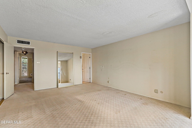 3134 Mesa Verde Ln, El Paso, TX 79904 - unfurnished bedroom with carpet, a textured ceiling, and baseboards