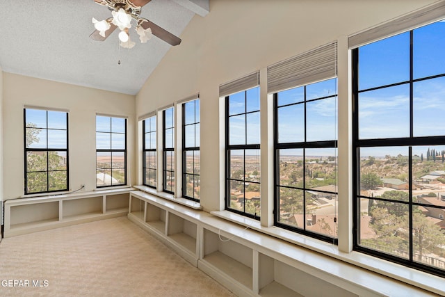 3134 Mesa Verde Ln, El Paso, TX 79904 - unfurnished sunroom featuring beam ceiling, carpet, high vaulted ceiling, and a decorative wall