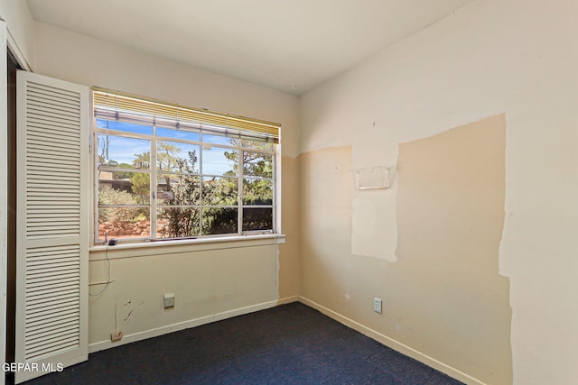 3134 Mesa Verde Ln, El Paso, TX 79904 - spare room with baseboards and dark colored carpet