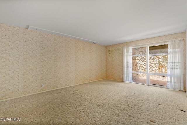 3134 Mesa Verde Ln, El Paso, TX 79904 - empty room featuring carpet flooring, wallpapered walls, and baseboards