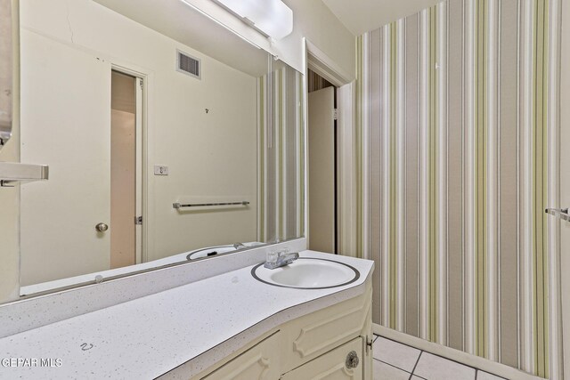 3134 Mesa Verde Ln, El Paso, TX 79904 - bathroom with vanity, tile patterned floors, and wallpapered walls