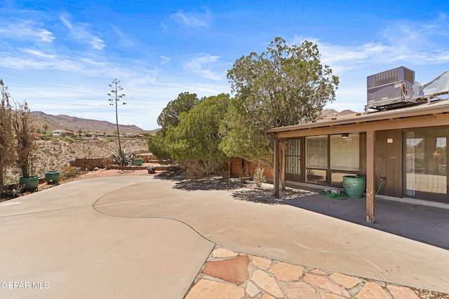 3134 Mesa Verde Ln, El Paso, TX 79904 - view of patio / terrace featuring a mountain view and central AC unit